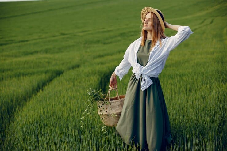 Woman in Green Dress in a Summer Field